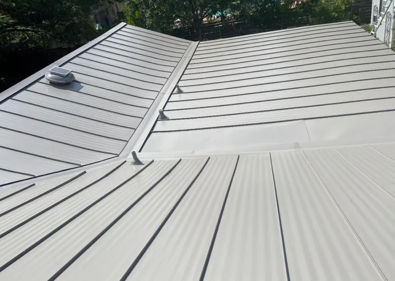 Solar attic fan installed on a metal roof for Roof Ventilation in East Pasadena